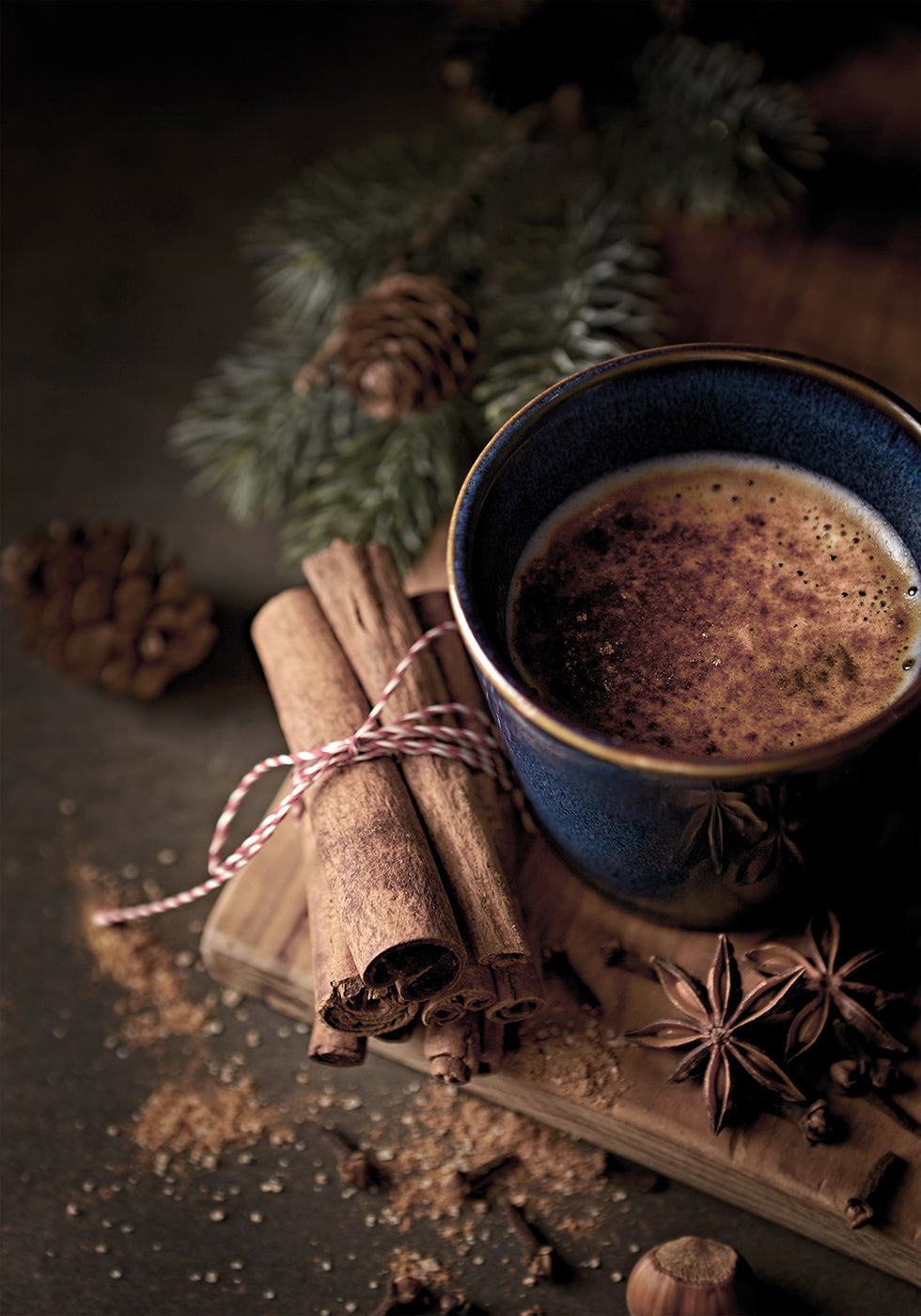 a cup of hot chocolate on a cutting board