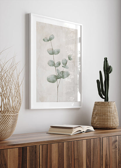 a picture of a plant and a book on a shelf