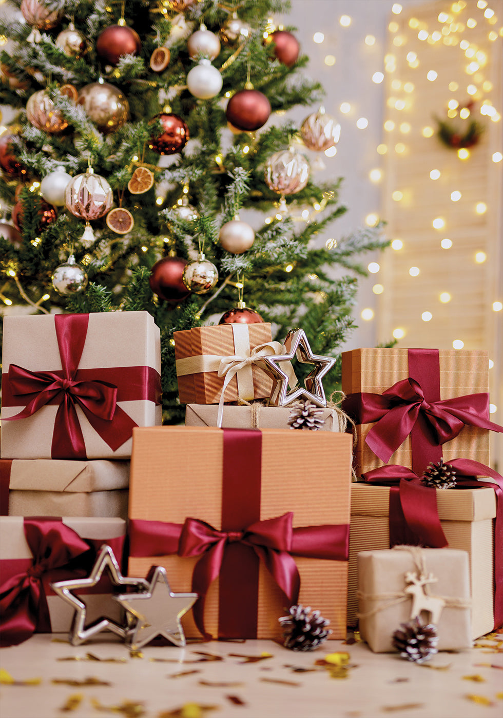 a group of wrapped presents under a christmas tree